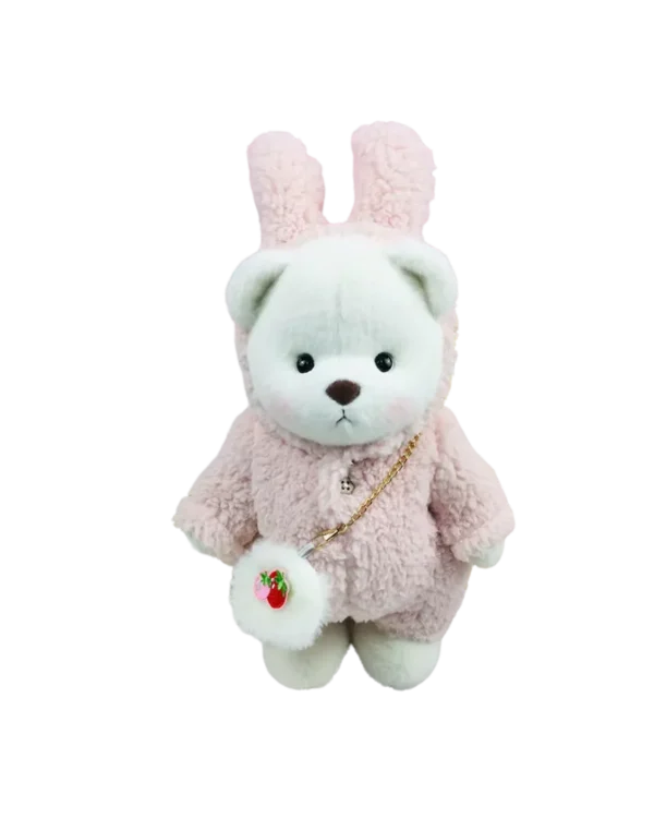 Ce mignon petit nounours blanc en lapin en laine avec son petit sac a main est debout de face