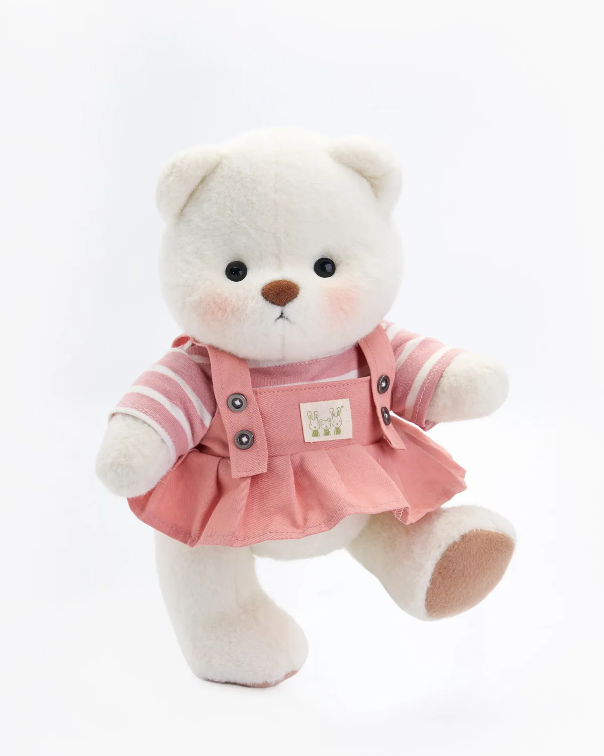 Petit nounours blanc en robe salopette rose 2 petit ourson blanc vêtu d'une robe salopette rose debout qui prend la pose
