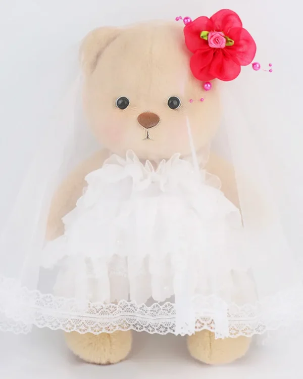 ours en peluche brun habillé en jolie robe de marié