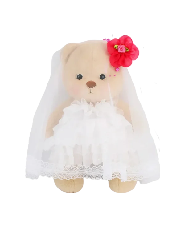 Cet adorable petit nounours brun en robe de mariée est prêt pour le grand jour il est de debout de face