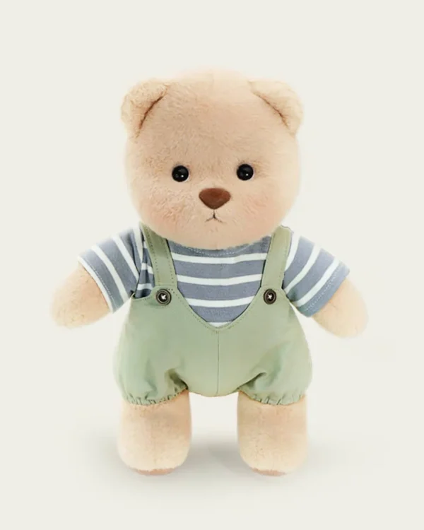 petit ourson en salopette verte debout