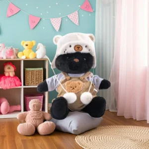 Petit nounours noir en salopette marron